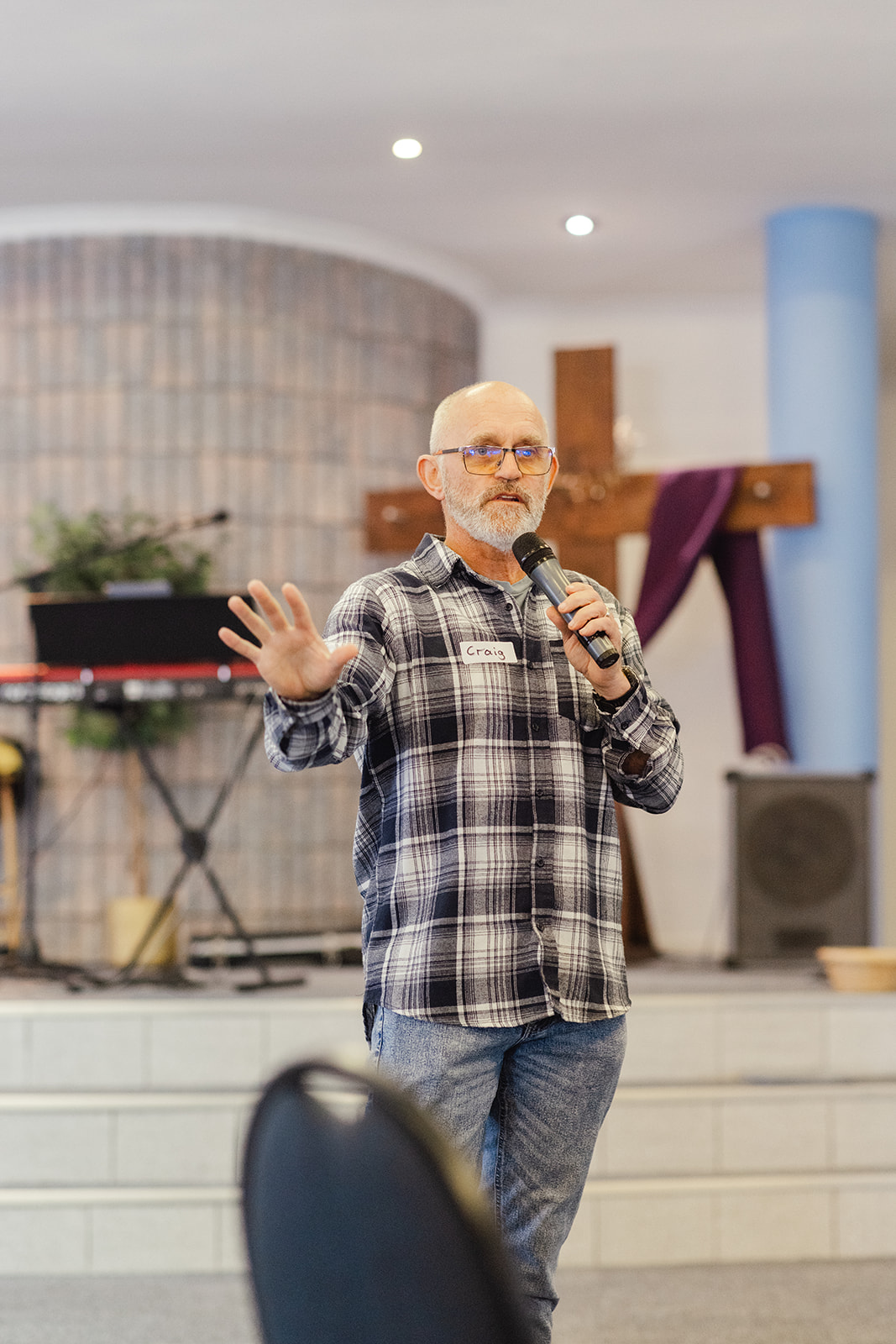 Leader teaching from the front of the church