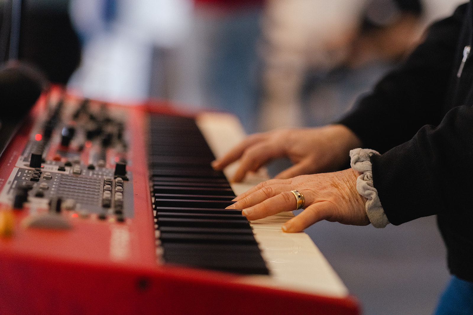 Close-up of hands playing keys during worship