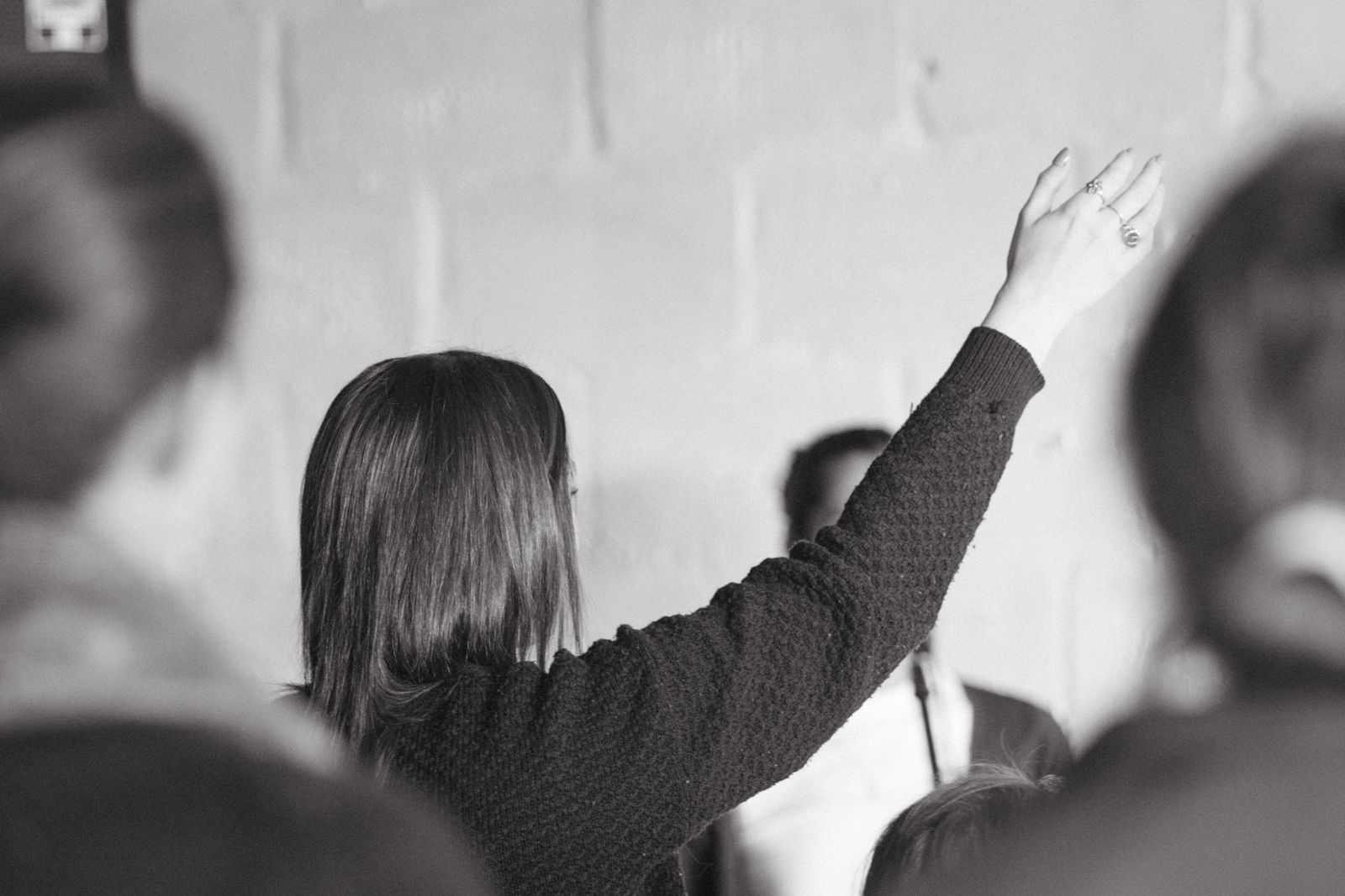 Worshipper raising a hand in prayer